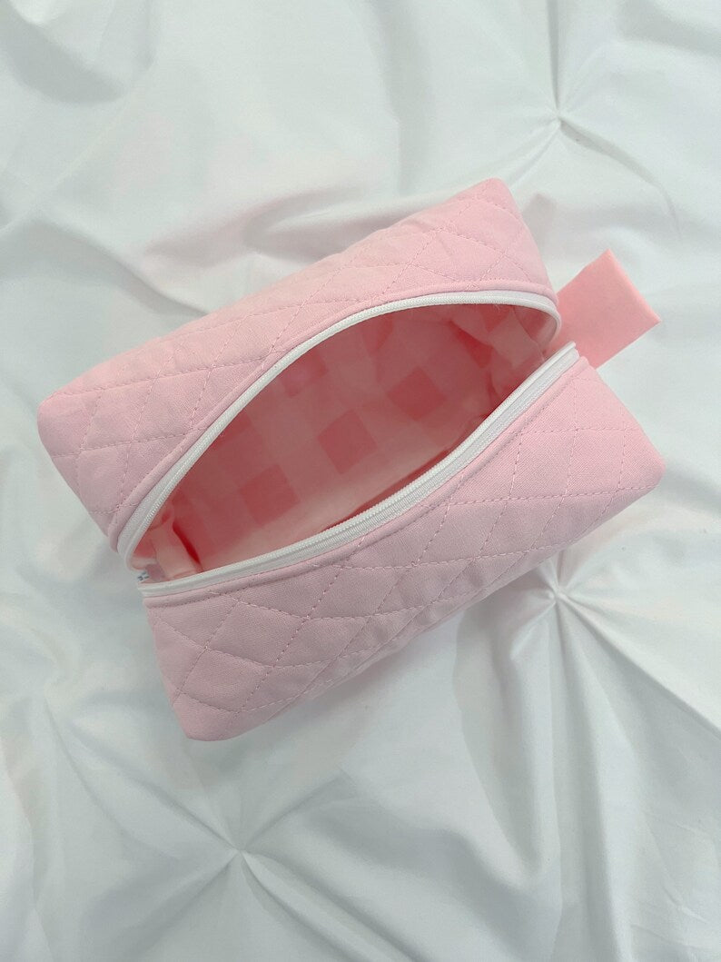 Pink quilted makeup bag