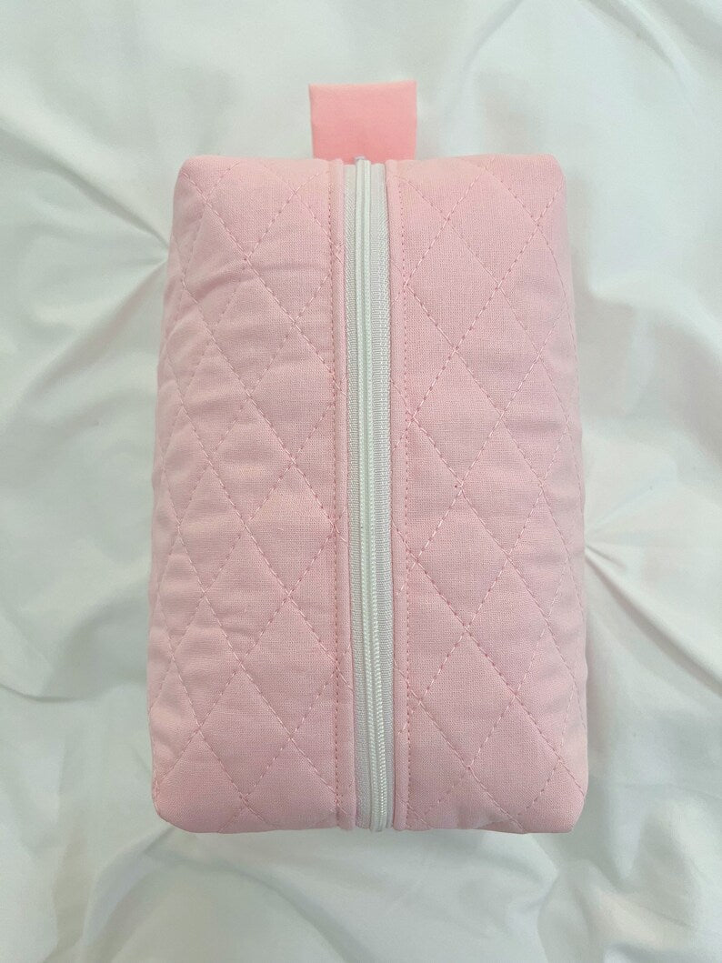 Pink quilted makeup bag